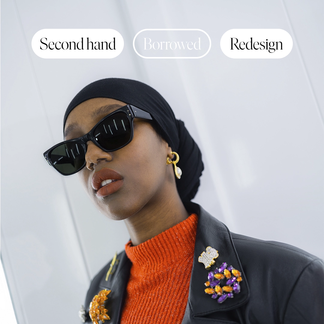 Woman with sunglasses, gold earrings looking into the camera - NyStudio